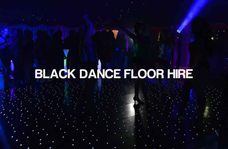 Photo of Dancers on a black LED star light dance floor