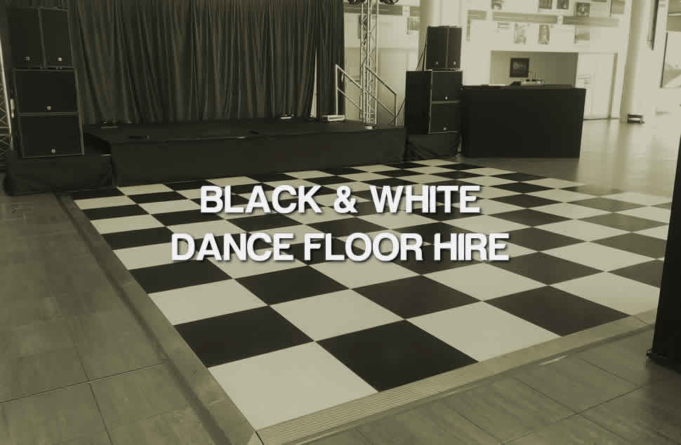 Photo of a 20x20ft Chequered black and white dance floor in front of a stage
