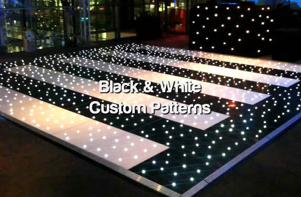Photo of a custom black and white patterned LED starlit dance floor with black and white stripes surrounded by a black border