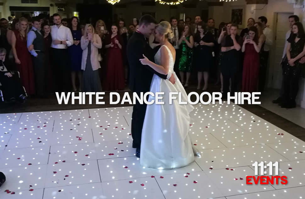 Photo of Married couple having their first dance on a 16x16ft white LED starlit dance floor installed at The Italian Villa in Poole, Dorset.