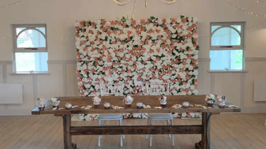 Kings Arms Christchurch rose pink, green, and white flower wall ceremony wedding backdrop