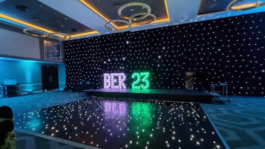 Hilton Bournemouth light up letters with company name on a black starlit dance floor