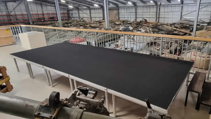Black stage setup at Bovington Tank Museum for a live stream during the World of Tanks military event