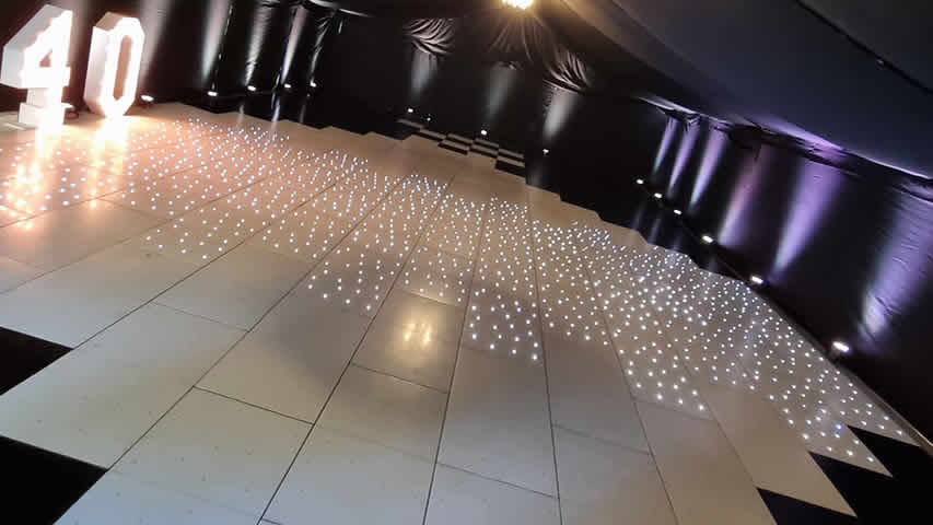 Black and white starlit dance floor at a 40th mix party in a marquee