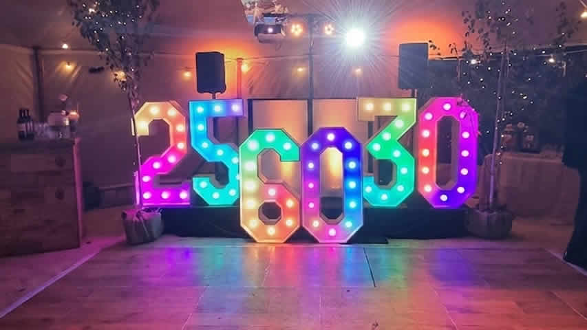 Party with multicoloured light up numbers on a dance floor at Oak Marquee for a birthday party