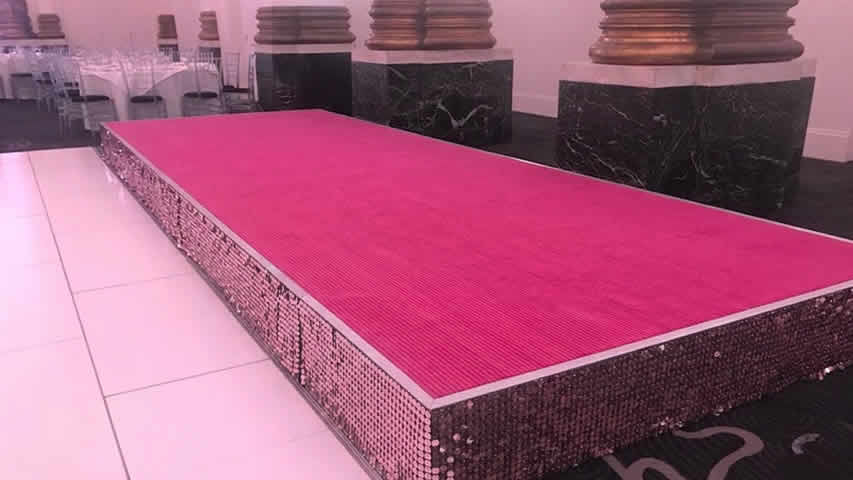 Pink stage with pink sequins, this vibrant setup is sure to impress guests!
