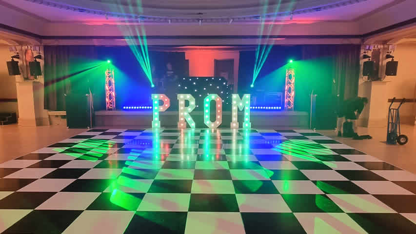 Prom chequered dance floor with DJ lighting and sound at a large party in Bournemouth Pavilion