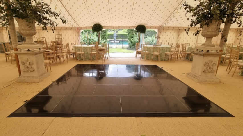 Black dance floor hire at a marquee in Wiltshire