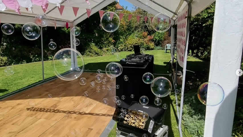 Bubble machine effect at an outdoor garden party