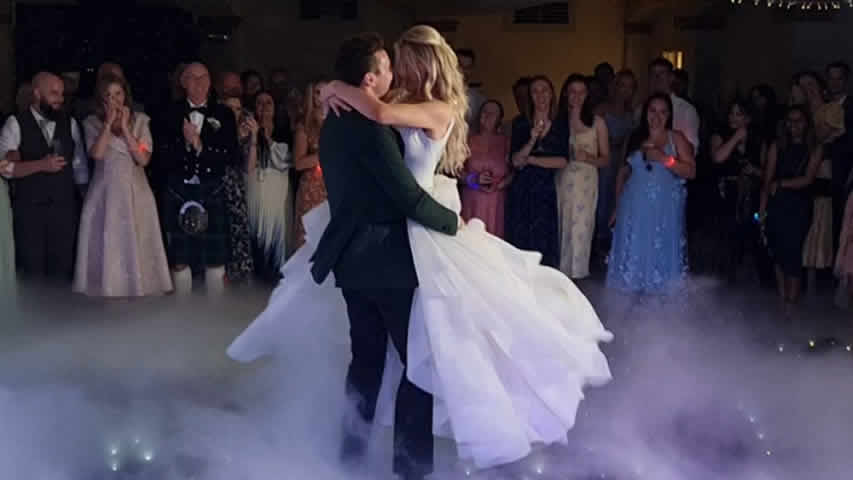 First dance with dry ice clouds on a black starlit dance floor at Italian Villa Poole