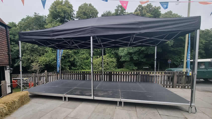 6x3m stage covered with a black gazebo