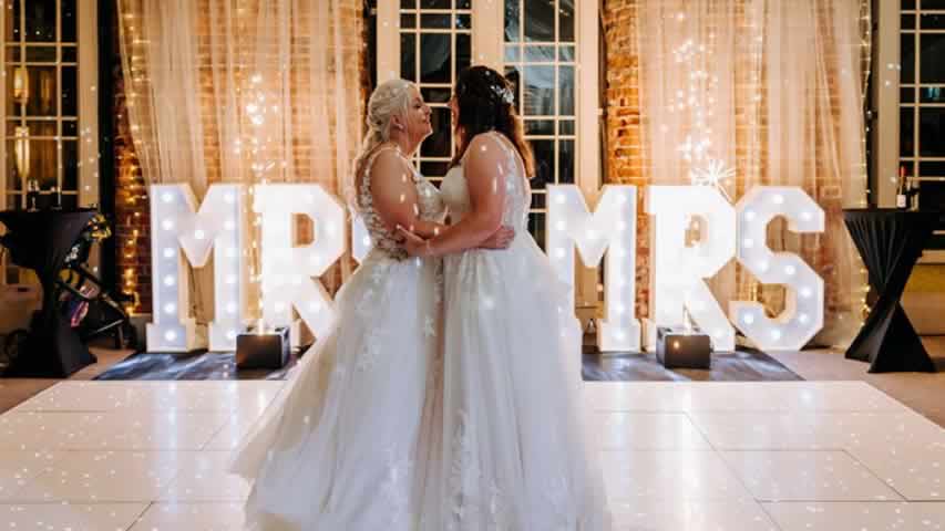 Wedding at Highcliffe Castle with first dance on a white dance floor with sparks