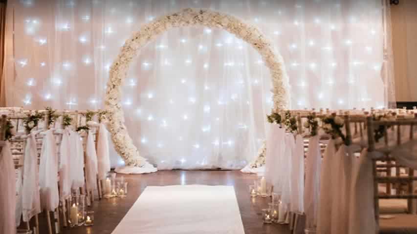 At the Connaught in Bournemouth we installed a starcloth backdrop covered with voile to create this twinkly wedding ceremony backdrop