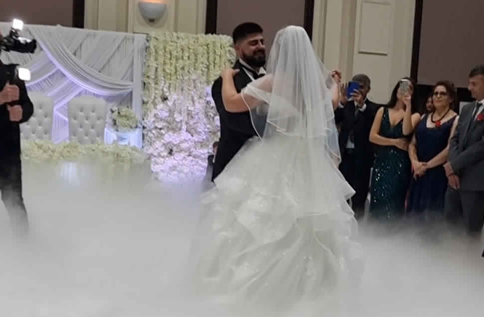 wedding first dance with dry ice dancing on the clouds