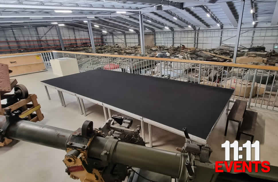 Black carpet stage 600mm high for filming 5x2m at Bovington Tank museum