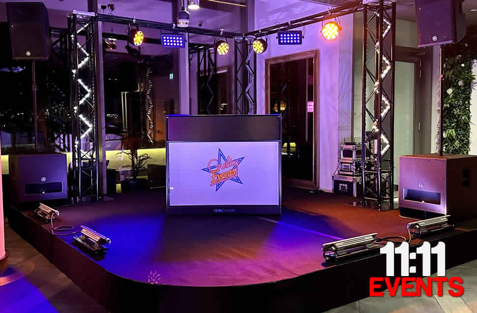 Hilton Bournemouth, Black curved stage with black carpet and skirt for guilty events with lamps and amps sound and lighting